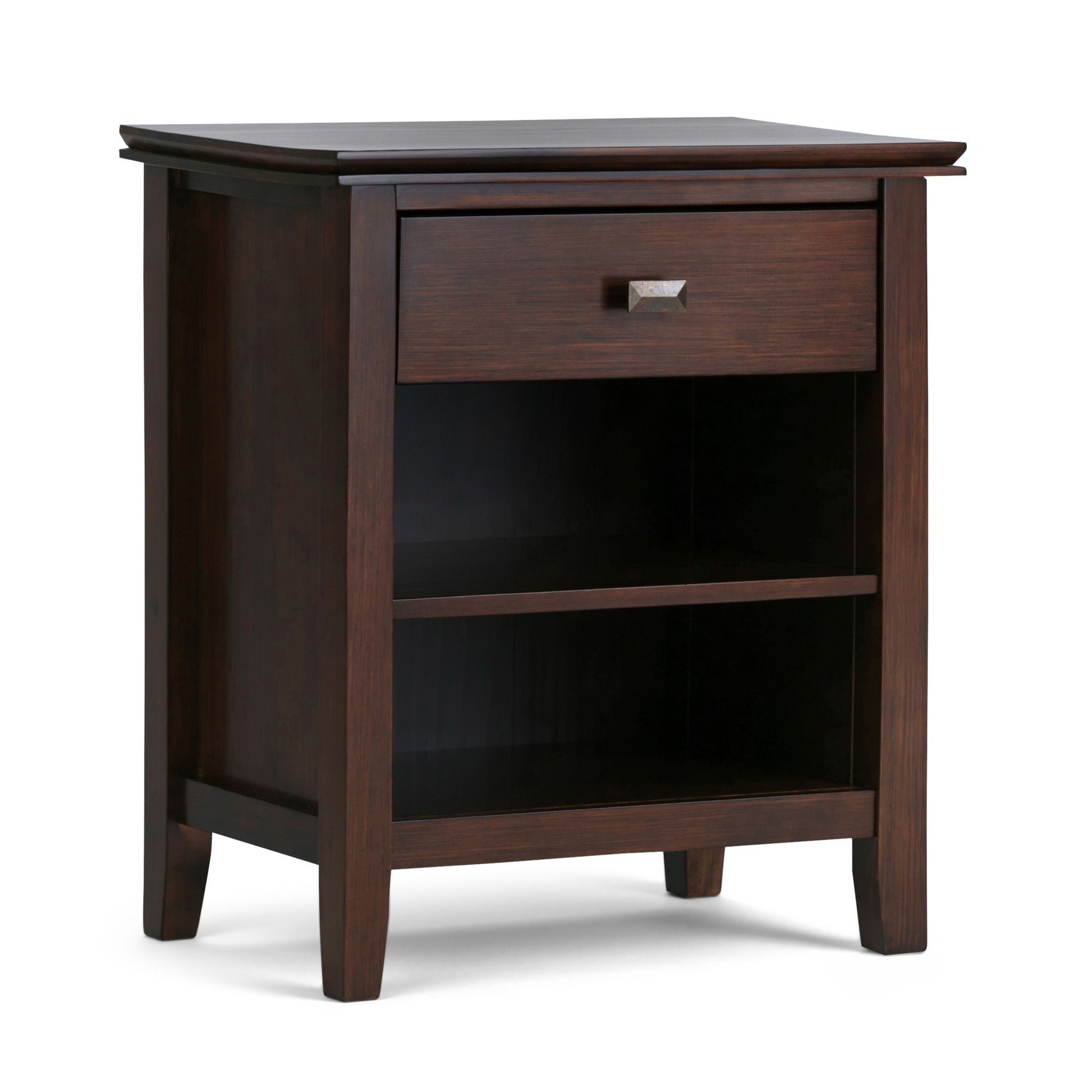 The Artisan - Handcrafted Bedside Table is a dark wood nightstand with one drawer featuring a metal handle, two open shelves, and four tapered legs.