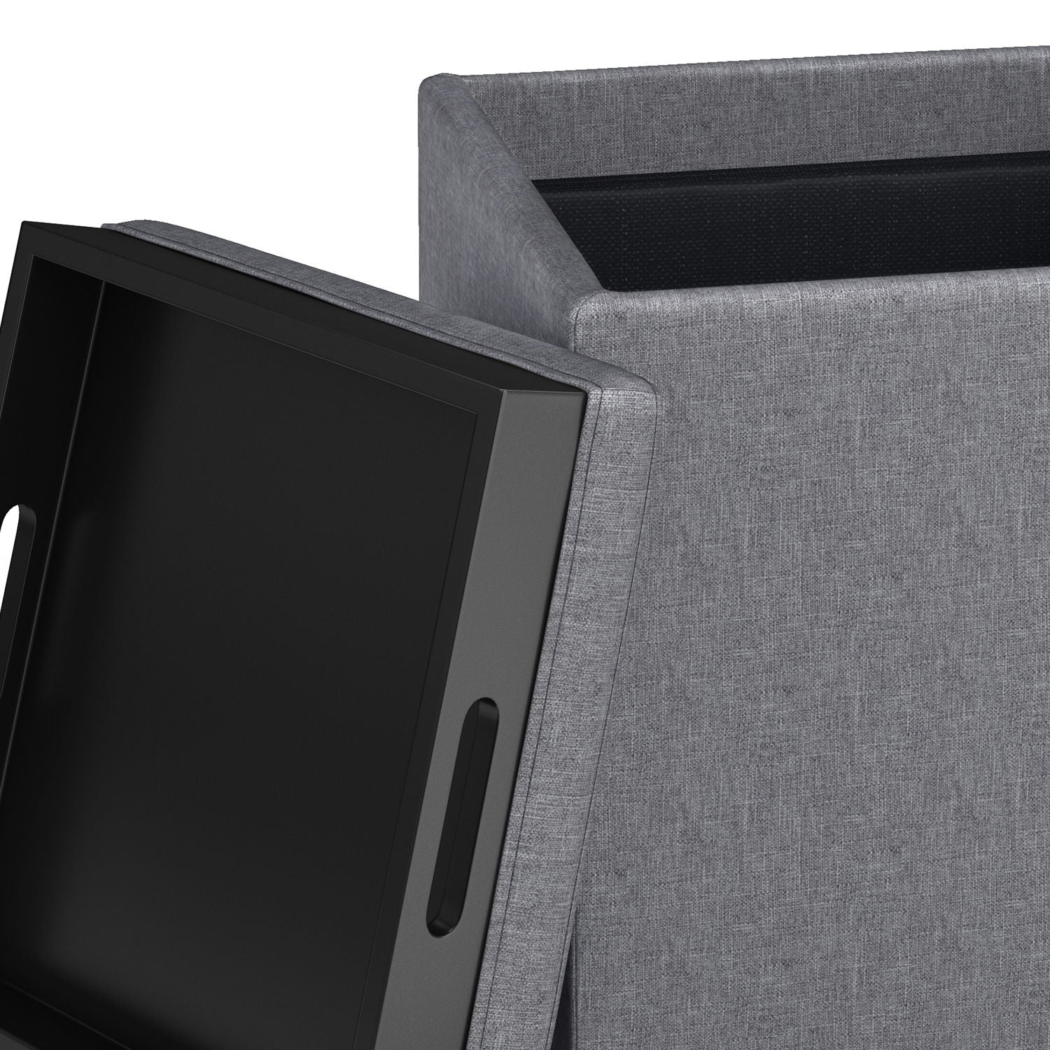 A close-up of the Rockwood Upholstered Cube Storage Ottoman With Tray, shown in gray fabric with its lid off, displaying a black handled tray inside.