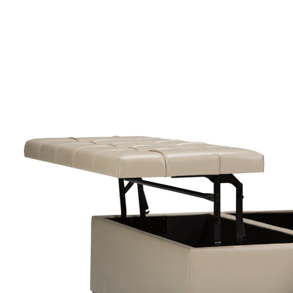 The Harrison - Upholstered Coffee Table Storage Ottoman features a beige tufted, padded lid on black metal hinges, partially open to reveal an empty storage compartment. The background is plain white.