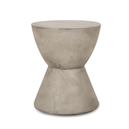 The Outdoor Hourglass Shaped Side Table - Light Gray features a smooth, minimalist concrete design with a wide, round top and bottom joined by a narrow center for a modern look.