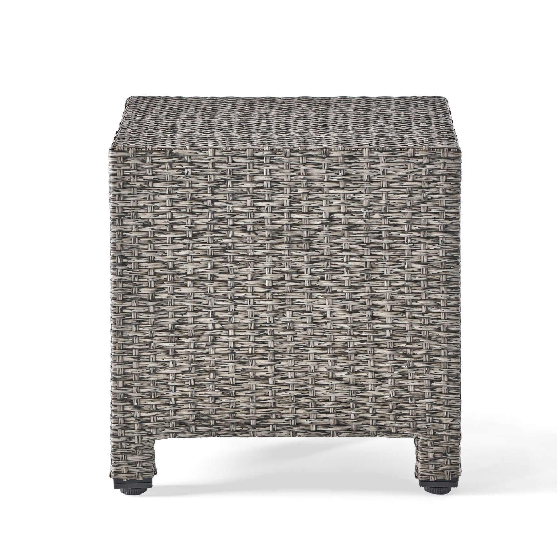 The Puerta Minimalist Style Accent Table features a light and dark gray woven wicker pattern, short legs, and a simple modern design, shown on a white background.