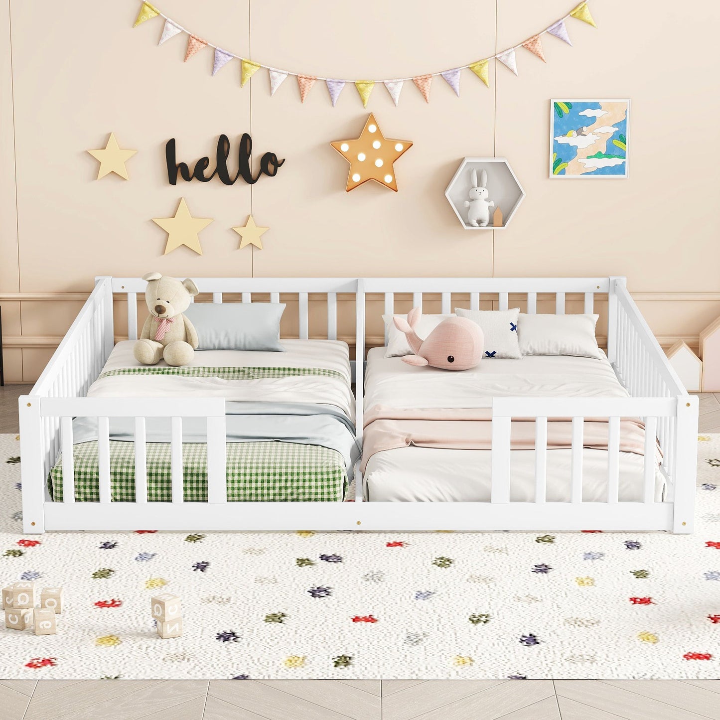 A children's bedroom features a Double Floor Bed With Fence and guardrails (no door), placed side by side with green checkered and pink bedding, plush toys, and a wall decorated with stars, "hello" sign, and bunting.