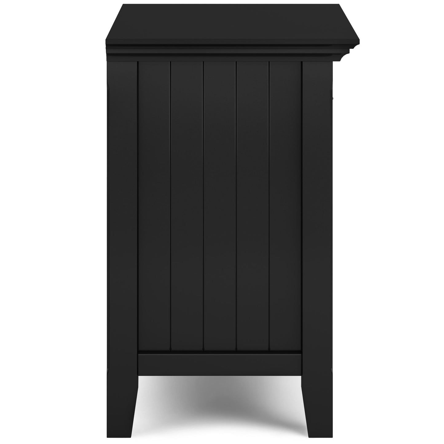 Side view of the Acadian - Bedside Table, Handcrafted in black wood with a paneled design, rectangular top, short legs, and smooth straight edges.
