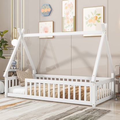 A Tent-Shaped Floor Bed, teepee bed with guardrails and slats, is featured in a modern room with neutral walls, patterned artwork, and decorative pillows and rugs.