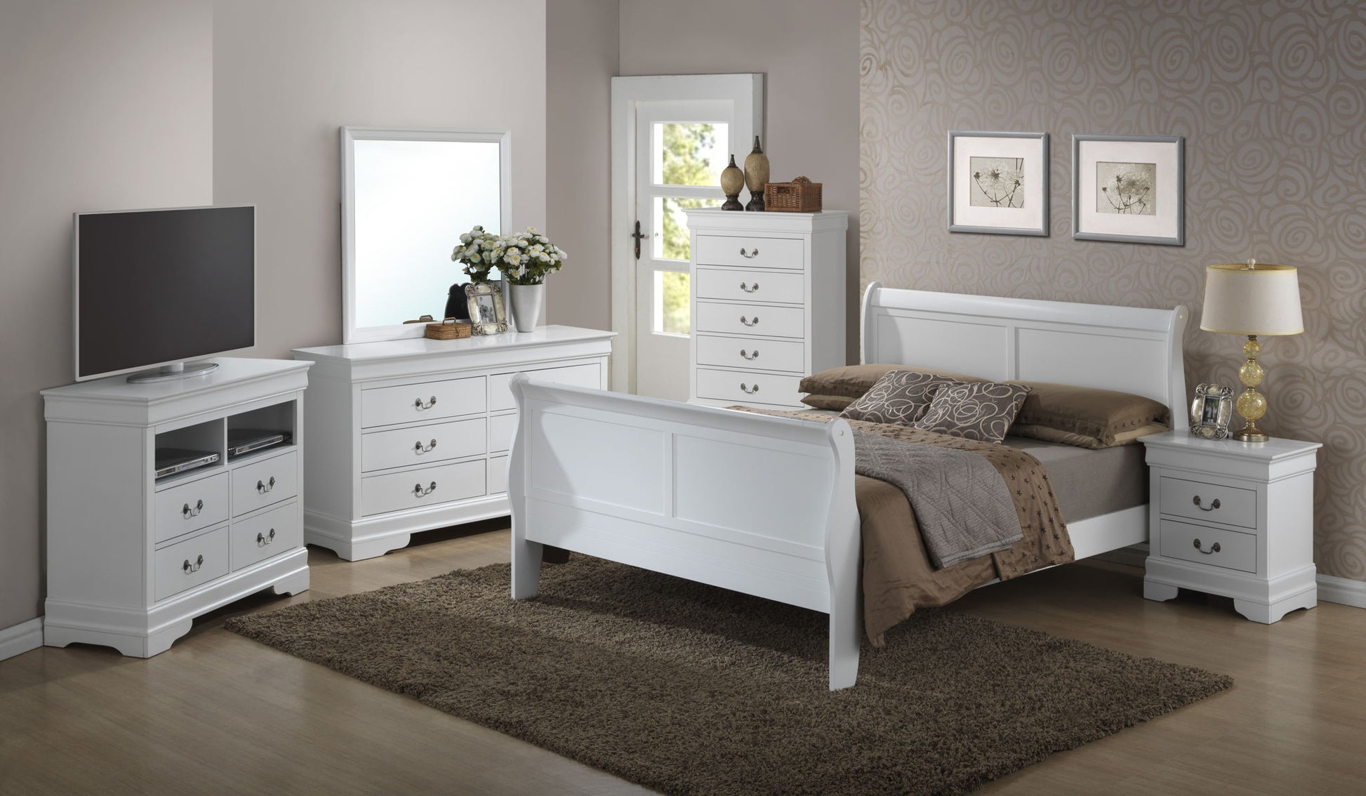 A bedroom featuring white furniture, including a Panel Sleigh Bed with brown bedding, dresser with mirror, chest of drawers, nightstand, and TV stand. A rug covers the wooden floor, complemented by wall decor and a lamp.
