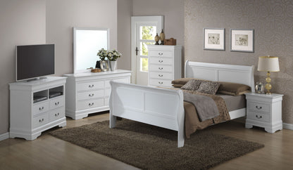A bedroom featuring white furniture, including a Panel Sleigh Bed with brown bedding, dresser with mirror, chest of drawers, nightstand, and TV stand. A rug covers the wooden floor, complemented by wall decor and a lamp.