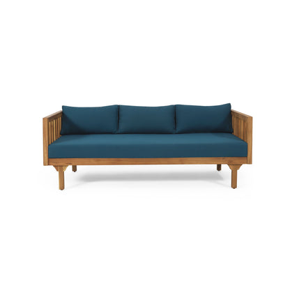 The Claremont 3 Seater Daybed features a teak acacia wood frame with vertical side slats and blue water-resistant cushions on the seat and back, shown against a white background.