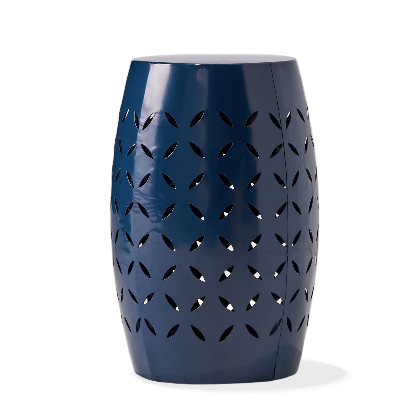 The 12" Outdoor Lace Cut Side Table features a glossy navy blue ceramic barrel shape with petal-shaped cutout details.