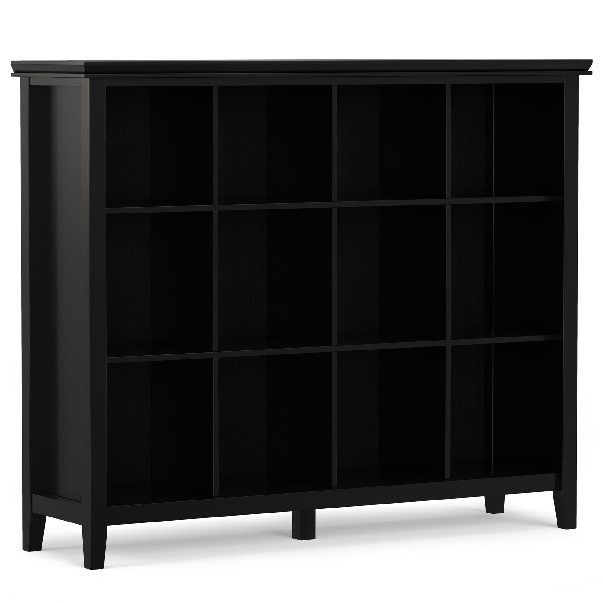 The Artisan - Cube Storage is a black wooden bookshelf with 12 square open compartments and four legs. Featuring a simple, modern design, it stands empty against a white background.