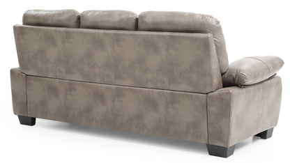 The Marta - Sofa is a grey, three-cushion piece with a smooth back, cushioned armrests and back, and square black legs, shown from an angled rear view.