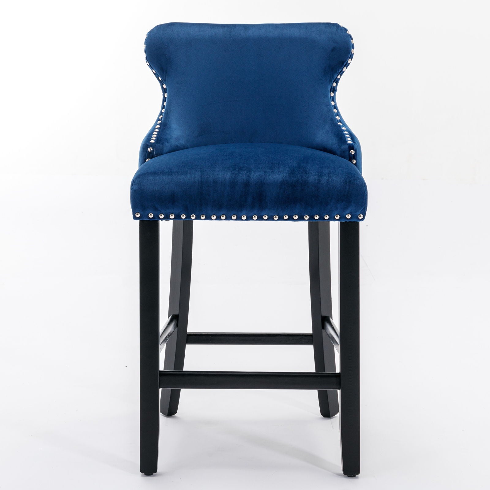 A set of two contemporary velvet upholstered wing-back barstools with button tufted decoration, chrome nailhead trim, and wooden legs, shown against a plain white background.