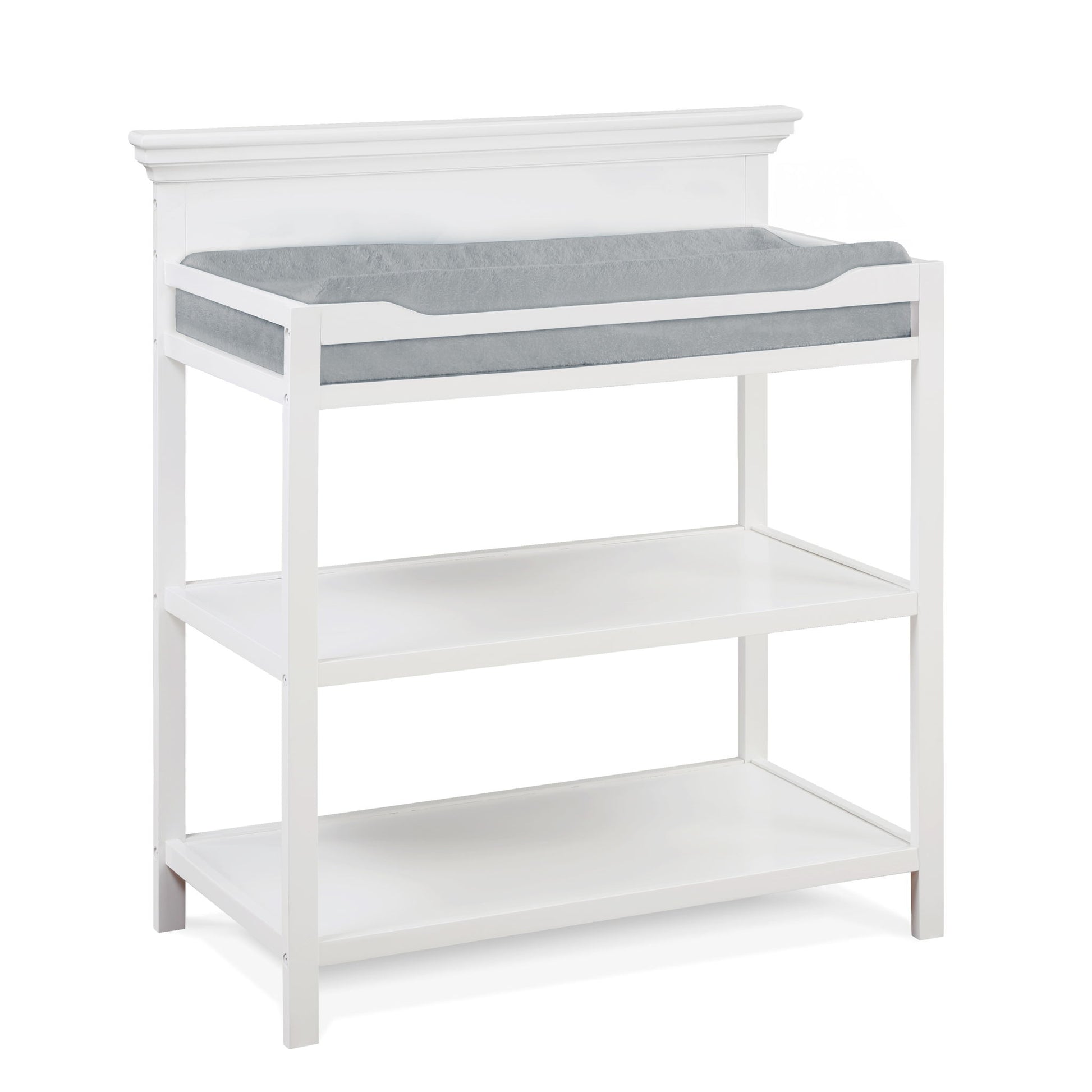 The Universal - Changing Table features a white wooden frame, two open shelves for storage, and a grey cushioned changing pad on top.