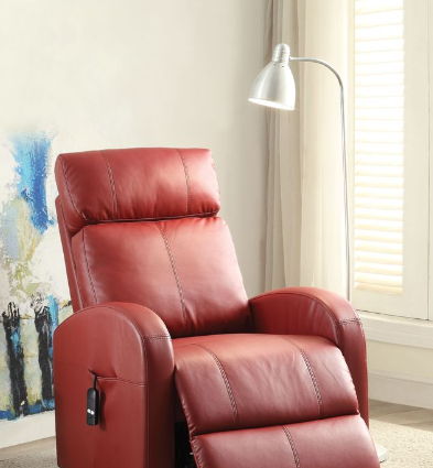 The Ricardo Power Motion Recliner With Lift in red leather is positioned beside a silver floor lamp and a window with white shutters, with a colorful abstract painting displayed on the wall behind.