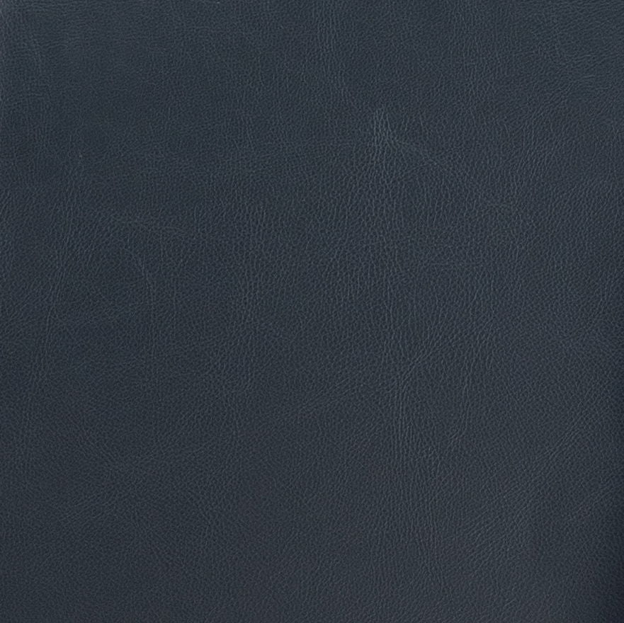A close-up view of the Vanity Cushioned Stool Chair Dark Brown shows its leather texture with fine, natural grain patterns across the dark brown surface.