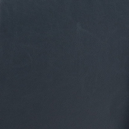 A close-up view of the Vanity Cushioned Stool Chair Dark Brown shows its leather texture with fine, natural grain patterns across the dark brown surface.