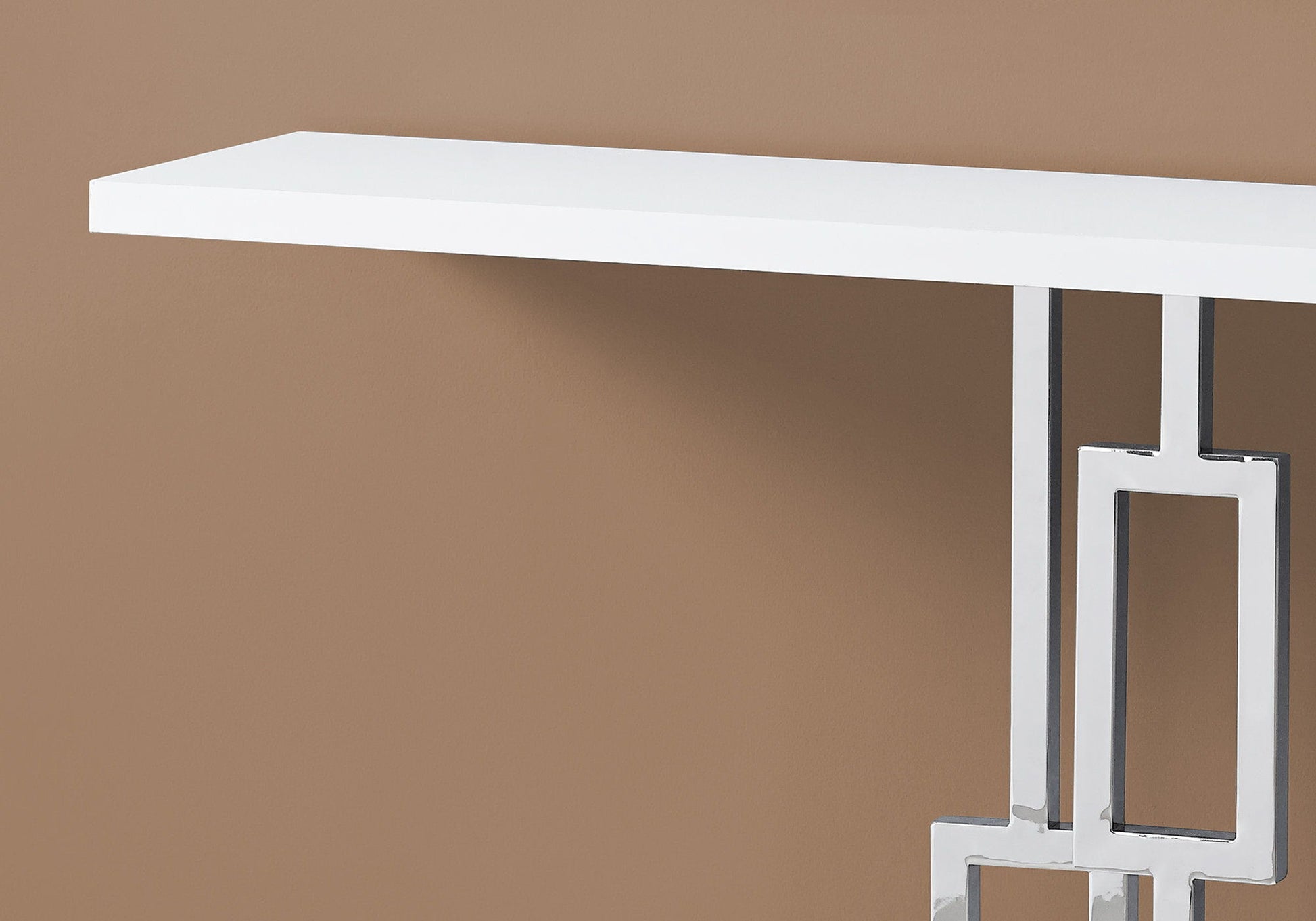 The Console Accent Table, Narrow For Living Room, features a sleek white rectangular top with geometric chrome legs, shown against a plain beige background.
