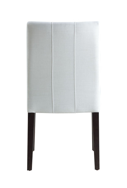 The Carena Side Chair (Set of 2) in white features a light gray upholstered back with straight vertical stitching and four dark wooden legs, shown against a plain white background.