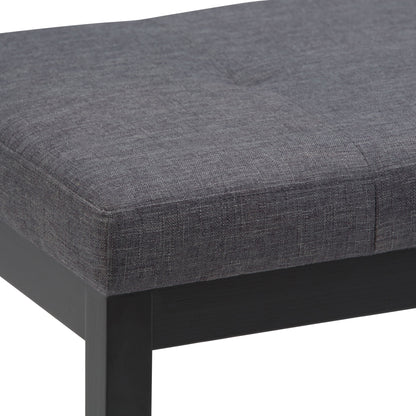 Close-up of the Lacey - Upholstered Tufted Ottoman Bench featuring a dark gray textured fabric seat with visible stitching and black wooden legs.