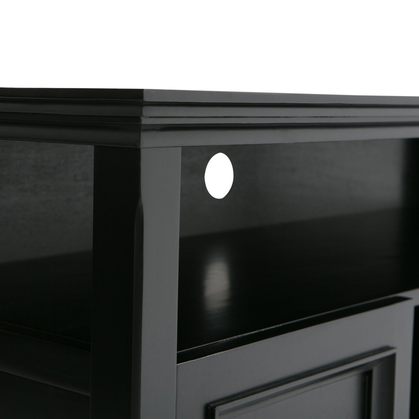 Close-up view of the Amherst - TV Media Stand, Handcrafted, in black wood with a shelf and a circular cable management hole at the back. The surface and edges are smooth with a glossy finish.
