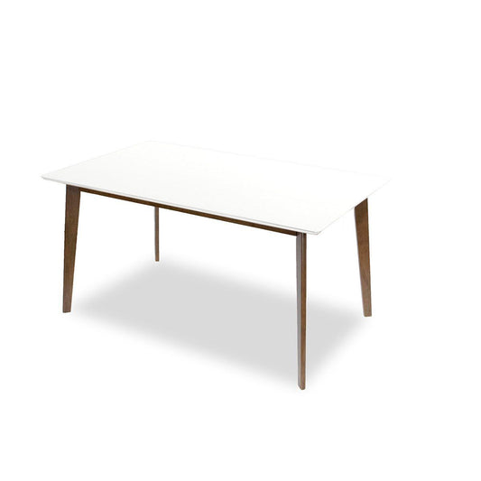 The Carlos Dining Table features a white rectangular top and four angled wooden legs, displayed against a plain white background.