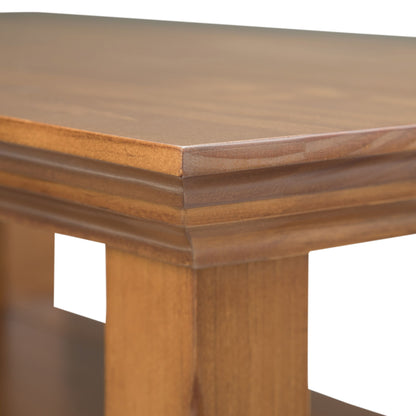 Close-up of the Acadian Narrow Side Table, handcrafted with a smooth, polished surface, decorative edge detailing, thick legs, and a light to medium brown wood finish.