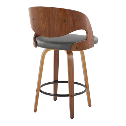 The Pino Mid Century Modern Fixed Height Barstools (Set of 2) feature curved wooden backrests, gray cushioned seats, four angled wooden legs with a black round footrest, exposed hardware, and sleek styling. Swivel included.