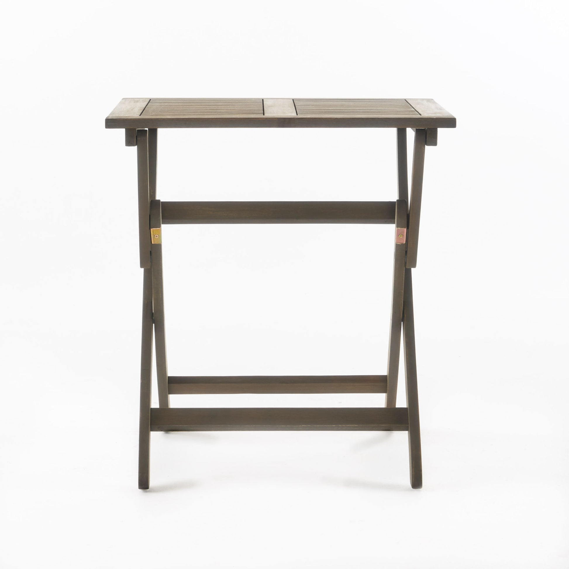 The Positano - Foldable Dining Set is a simple rectangular wooden table with horizontal slats on the tabletop and crossed legs, displayed against a plain white background.