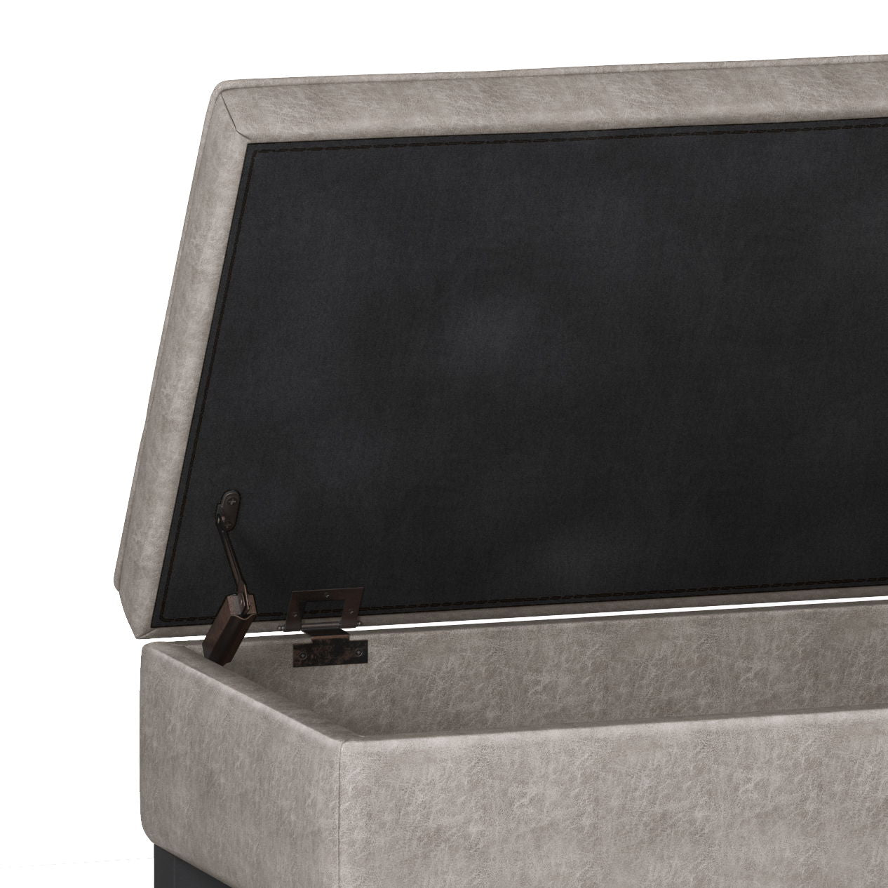 A close-up of the Cosmopolitan Storage Ottoman Bench With Open Bottom shows its beige cushioned lid, metal hinge mechanism, and spacious black interior compartment.