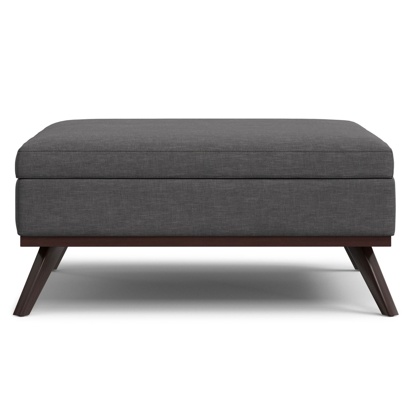 The Owen Multifunctional Square Coffee Table Storage Ottoman features a modern design with dark gray upholstery, a cushioned top, and angled wooden legs, shown from the front against a white background.