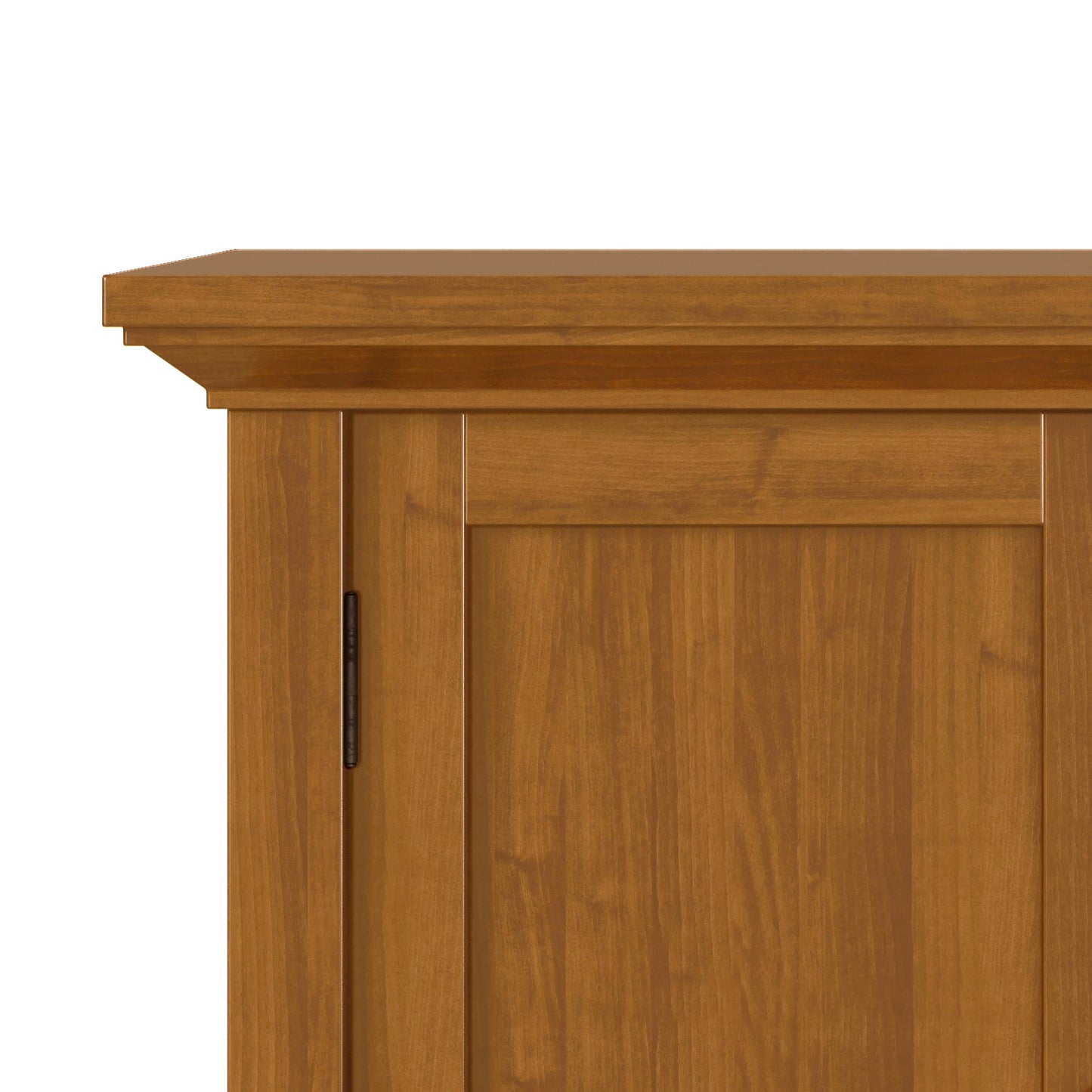 Close-up of the upper corner of the Redmond - Handcrafted Low Storage Cabinet, showing its light brown finish, flat top, and simple panel door design.
