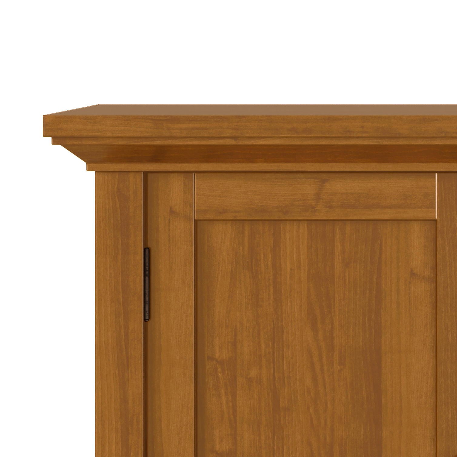 Close-up of the upper corner of the Redmond - Handcrafted Low Storage Cabinet, showing its light brown finish, flat top, and simple panel door design.