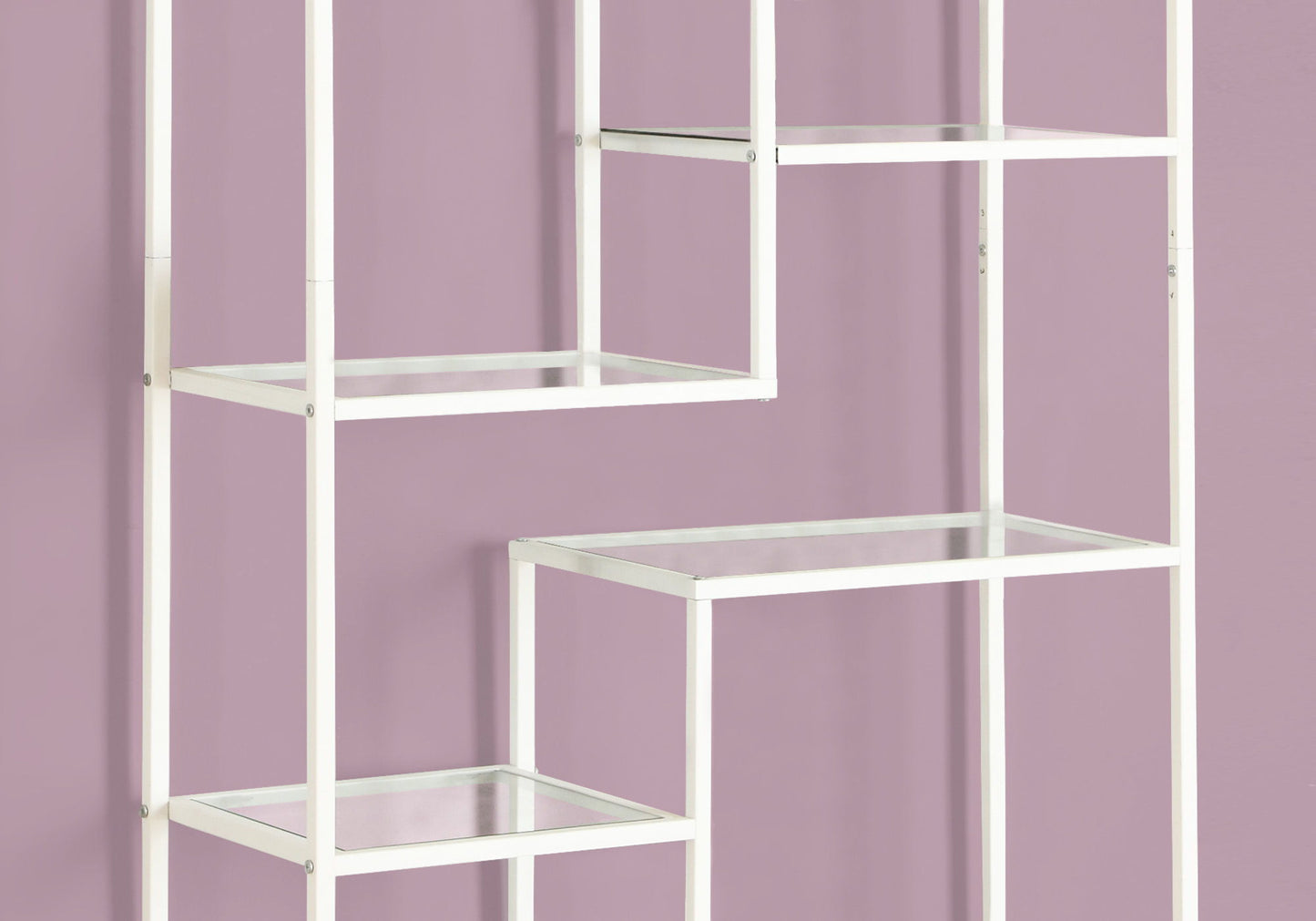 A contemporary white metal bookshelf with staggered rectangular glass shelves and open sides stands against a light mauve wall, featuring minimalist lines. Ideal as a bookcase or etagere for office or modern spaces.