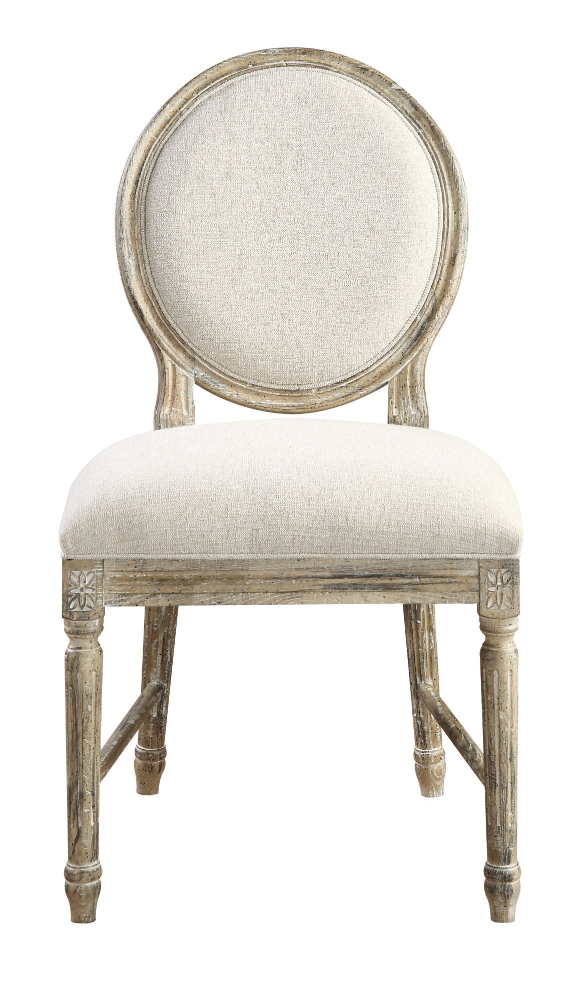 The Ludin Upholstered Dining Chairs (Set of 2) feature round, cushioned backs and seats in light beige fabric, with brown wooden frames showcasing a distressed finish and carved floral details.