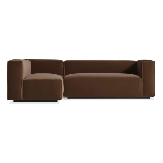 The Cleon Small Right Sectional Sofa, upholstered in coffee velvet, features a modern low-profile design with thick blocky arms and backrests, shown here against a plain white background.