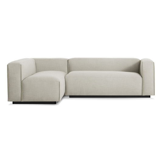 The Cleon Small Right Sectional Sofa, Maharam Mode in Calvicle, features a modern L-shape with clean lines, light gray upholstery, and low-profile back and arms, shown on a white background.