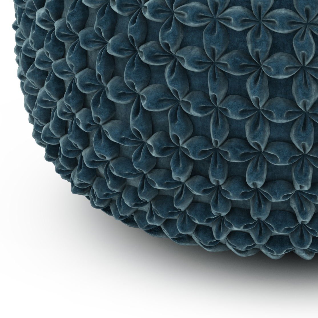 Close-up of Renee - Handcrafted Round Pouf in dark blue, showing its textured surface with a repeating pattern of raised, petal-like shapes on a white background.