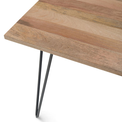 A close-up of the Hunter - Square Tabletop Dining Table shows its natural, varied wood grain and color, supported by sleek black metal hairpin legs.