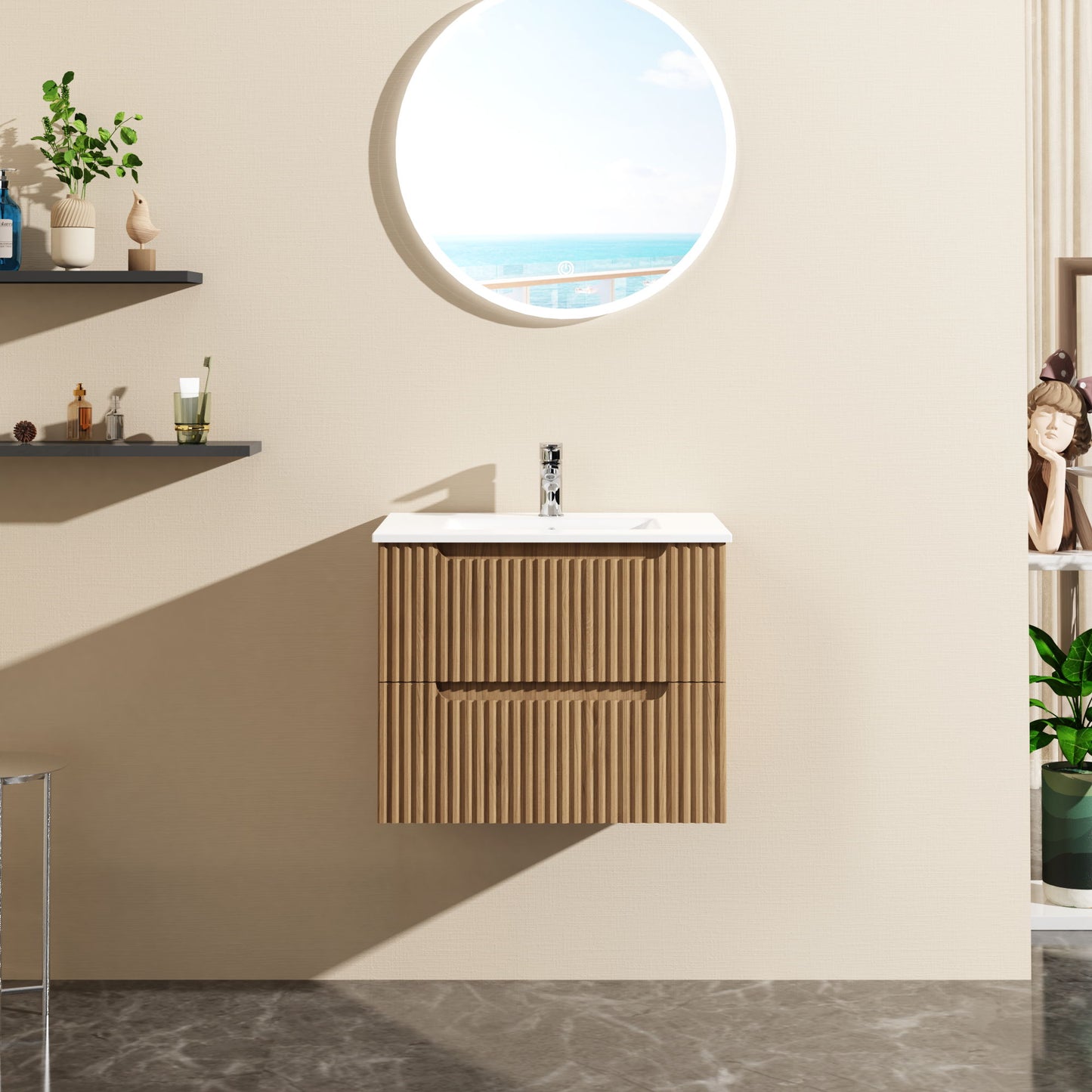 The 24" Wall Mount Bathroom Vanity Cabinet Floating (Cabinet Only) in walnut is mounted on a beige wall, paired with a white sink. A round mirror shows the sea and sky, while shelves with decor are seen to the left.