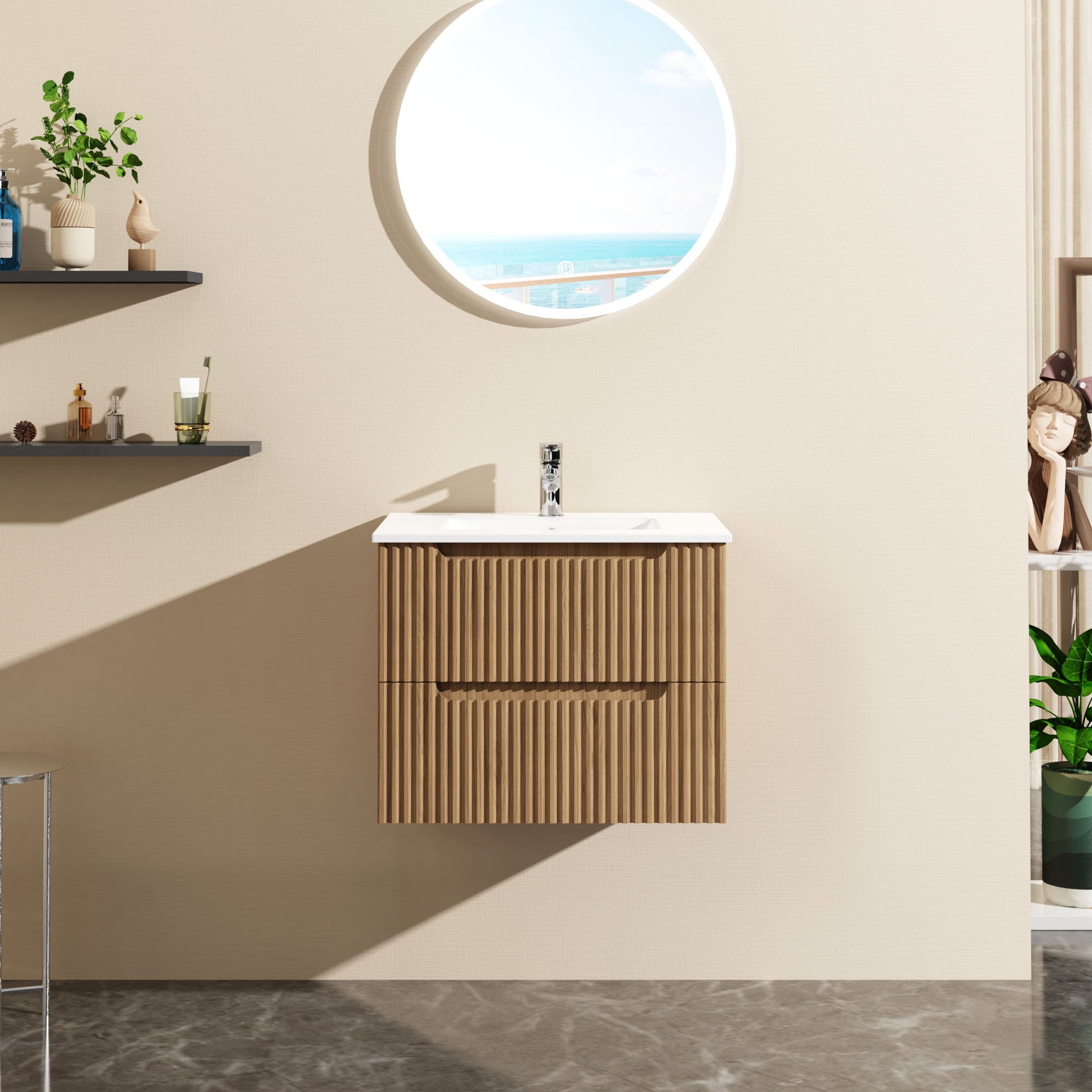 The 24" Wall Mount Bathroom Vanity Cabinet Floating (Cabinet Only) in walnut is mounted on a beige wall, paired with a white sink. A round mirror shows the sea and sky, while shelves with decor are seen to the left.