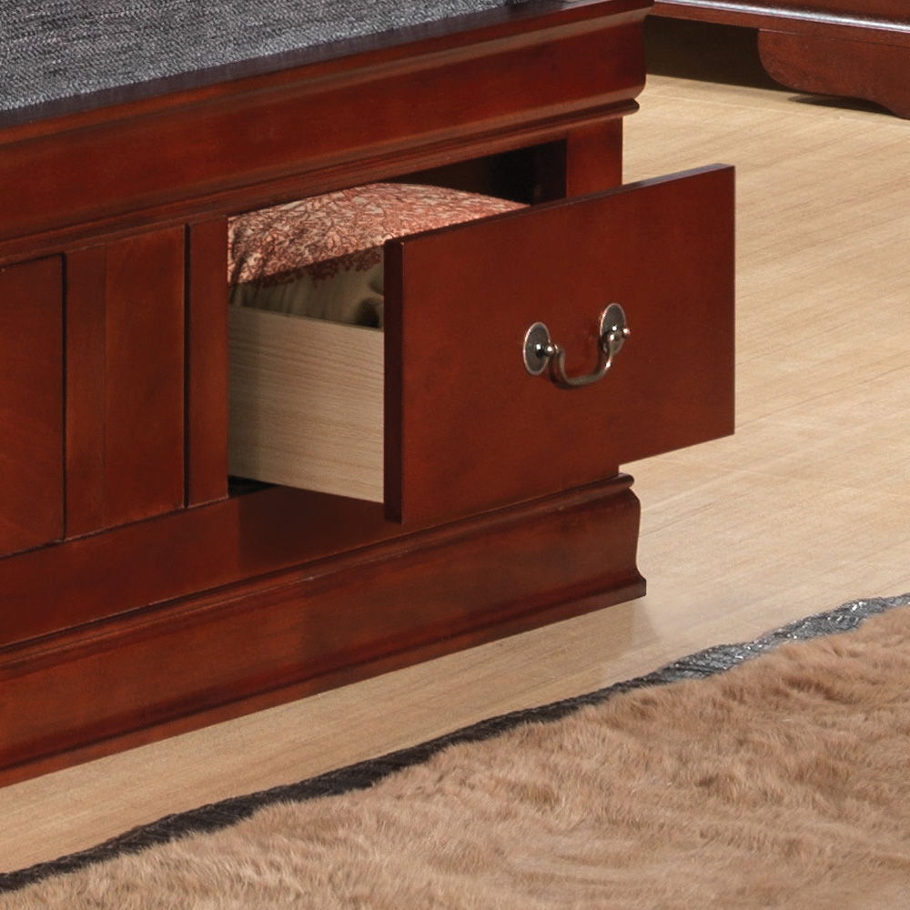 A close-up of the Louis Phillipe - Bookcase Storage Bed shows a wooden drawer partially open with a folded blanket inside, placed on a light-colored floor beside a beige rug.