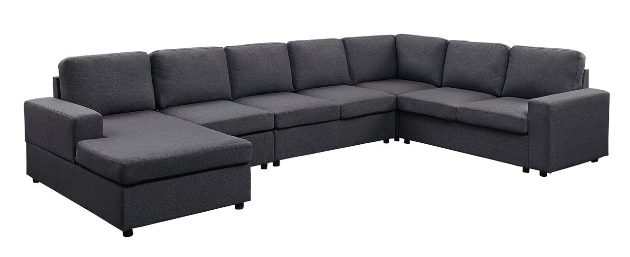 The Hayden Linen 7 Seat Reversible Modular Sectional Sofa Chaise is a large, L-shaped dark gray sofa with seven seat and back cushions plus a left-side chaise, set against a white background.
