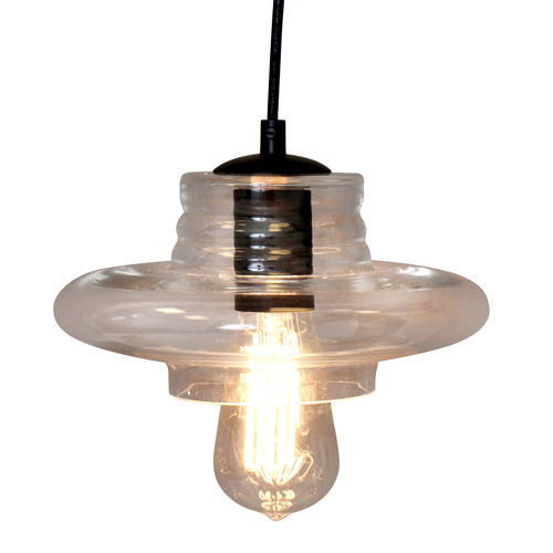 The Torus - Saucer Industrial Pendant - Clear features a clear glass shade and an exposed vintage-style filament bulb, suspended by a black cord.