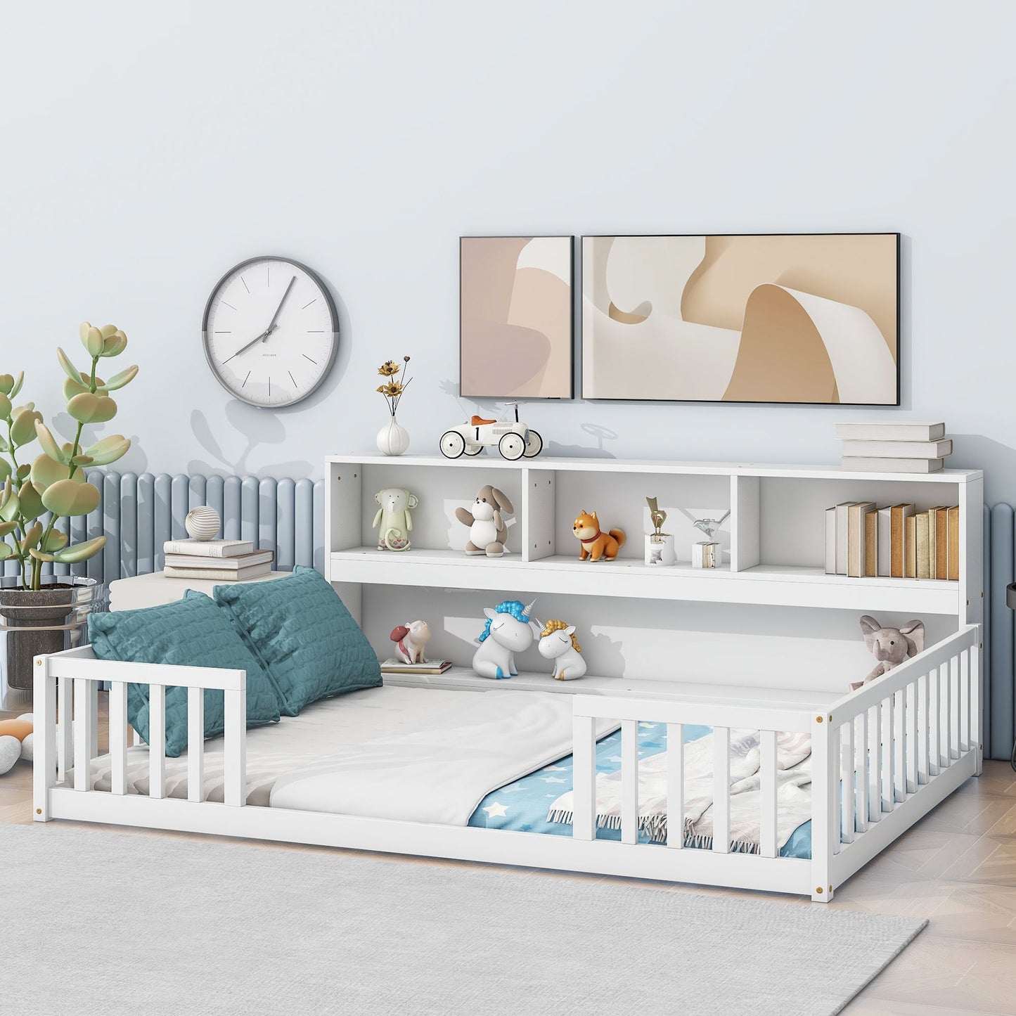 A modern children's bedroom with a white Floor Bed With Side Bookcase, Shelves, and Guardrails, blue and white bedding, toys and books on the headboard shelf, wall art, a clock, a large plant, all set on a light wooden floor.