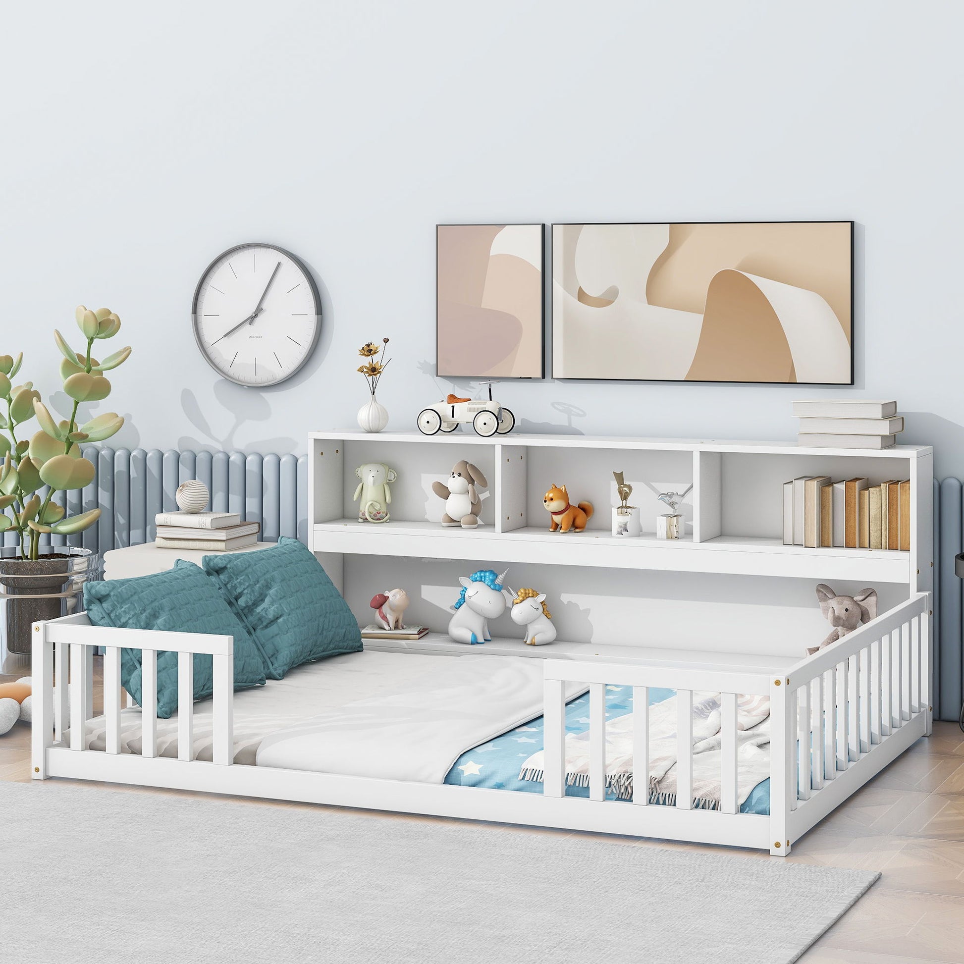 A modern children's bedroom with a white Floor Bed With Side Bookcase, Shelves, and Guardrails, blue and white bedding, toys and books on the headboard shelf, wall art, a clock, a large plant, all set on a light wooden floor.