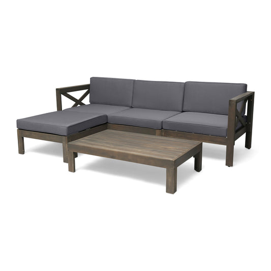 The Alcove - L Shape Sofa Set features a wooden outdoor sectional with gray cushions, an attached chaise lounge, and a matching low rectangular coffee table.