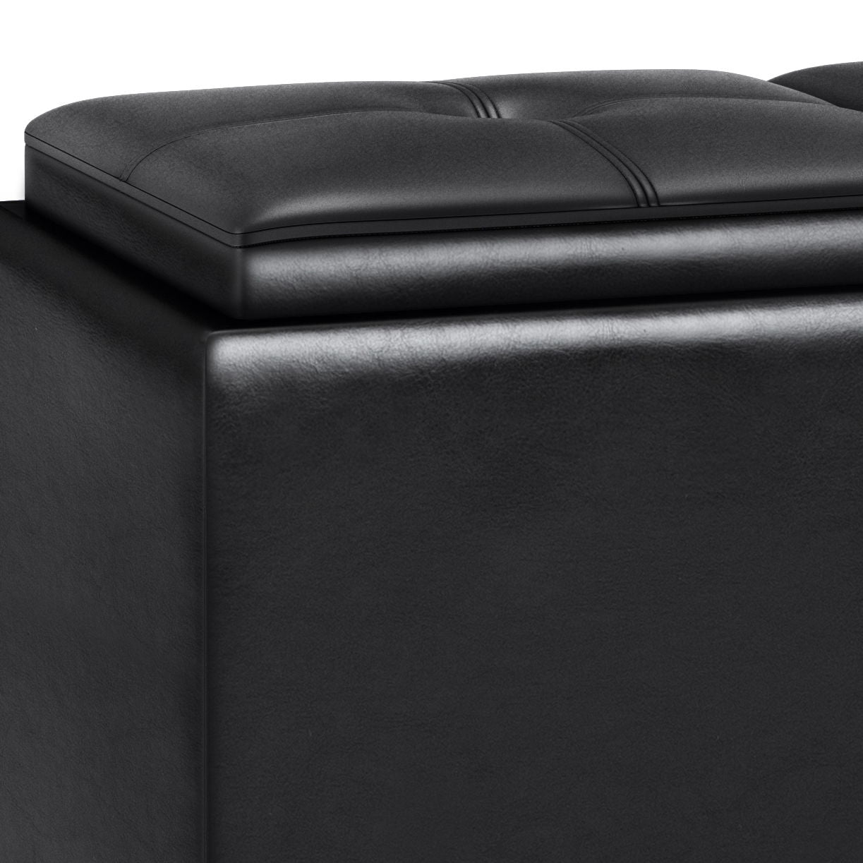Close-up of the Avalon Tray Storage Ottoman With Lift Up Lids in Midnight Black, featuring a cushioned, tufted top and smooth sides. The slightly raised lid suggests hidden storage space inside the ottoman.