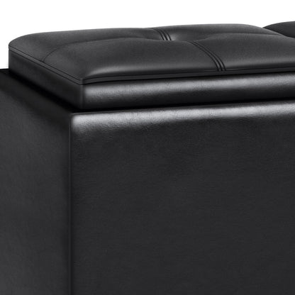 Close-up of the Avalon Tray Storage Ottoman With Lift Up Lids in Midnight Black, featuring a cushioned, tufted top and smooth sides. The slightly raised lid suggests hidden storage space inside the ottoman.