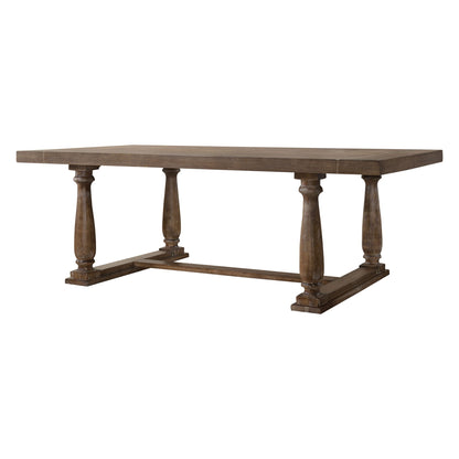 The Bernard - 7 Pieces Dining Room Set features a rectangular wooden table with a thick top, four turned pedestal legs joined by a rectangular base frame, and a medium brown rustic finish for an inviting dining space.
