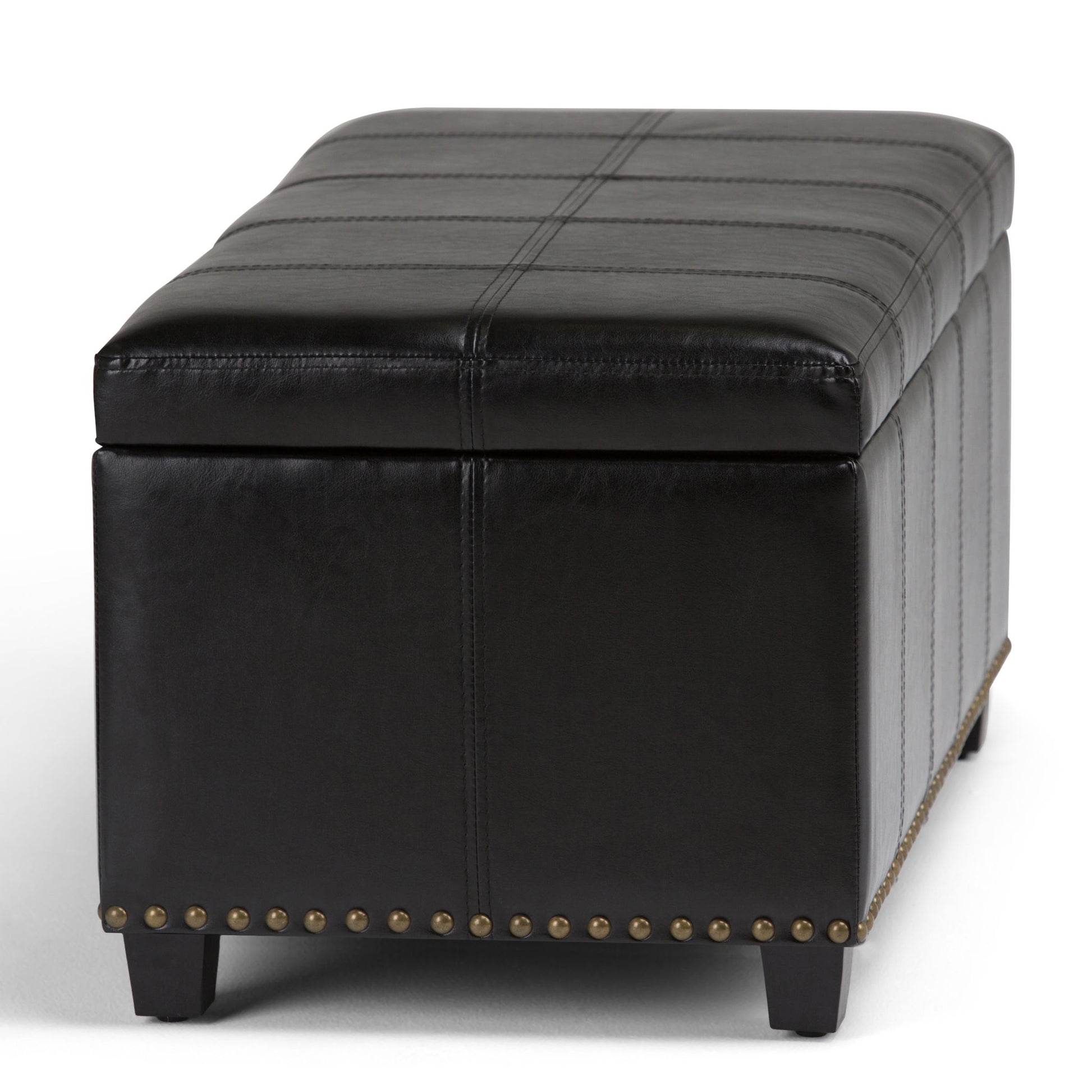 The Amelia - Transitional Storage Ottoman Bench features a rectangular black leather design with visible stitching, nailhead trim along the bottom edge, and short black legs.