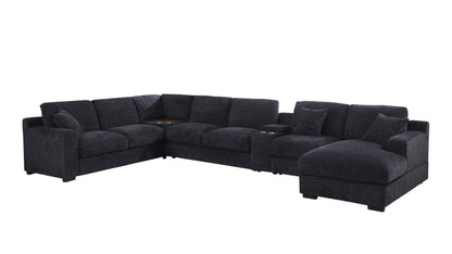 The Celine sectional sofa, in dark gray chenille fabric, features an L-shape with a right-facing chaise. It includes cup holders and charging ports, along with plush cushions that accommodate multiple people comfortably.